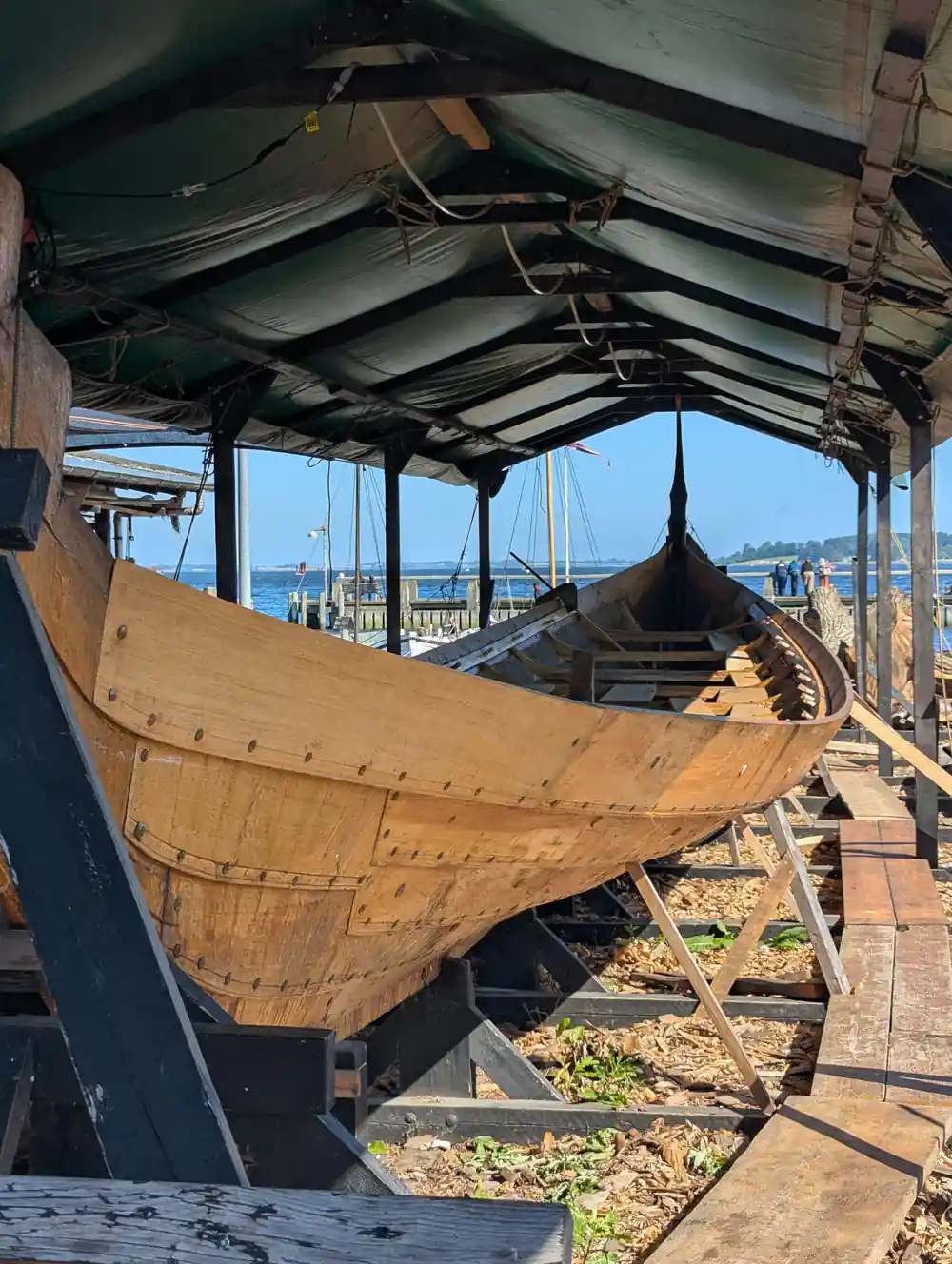 Ancient Viking ship replica under covered shelter