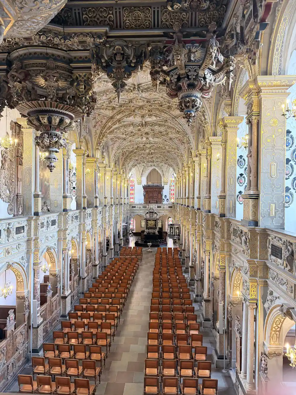 Church interior with ornate columns and blue tiles