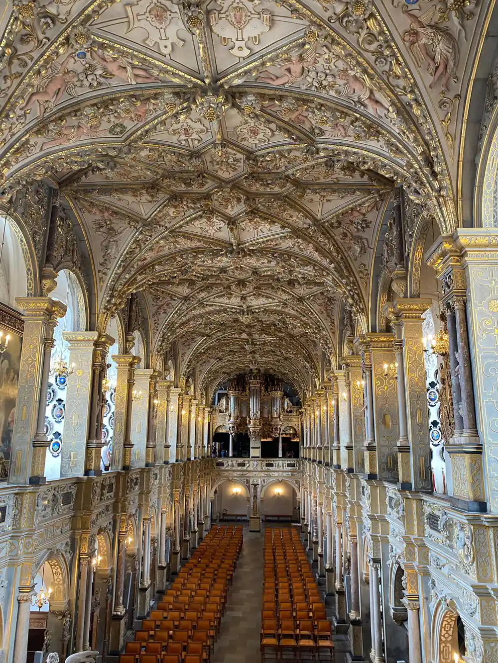 Church interior with ornate painted ceiling and columns