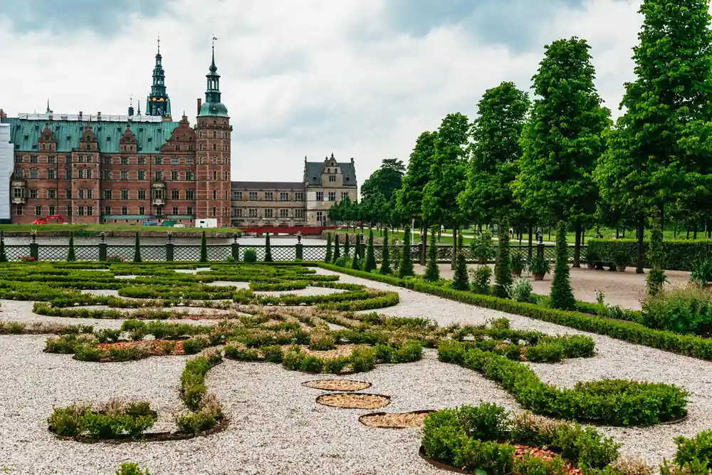 Formal garden with hedge patterns and castle behind
