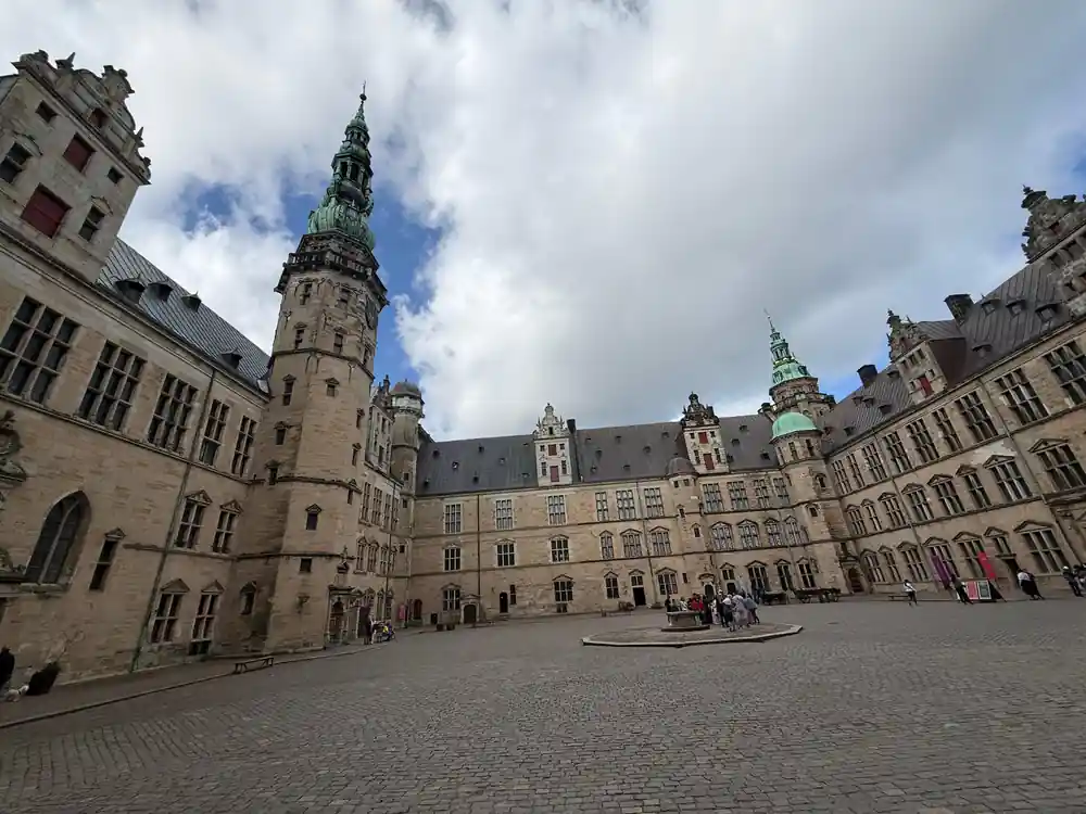 Medieval castle courtyard with Gothic architecture and tower