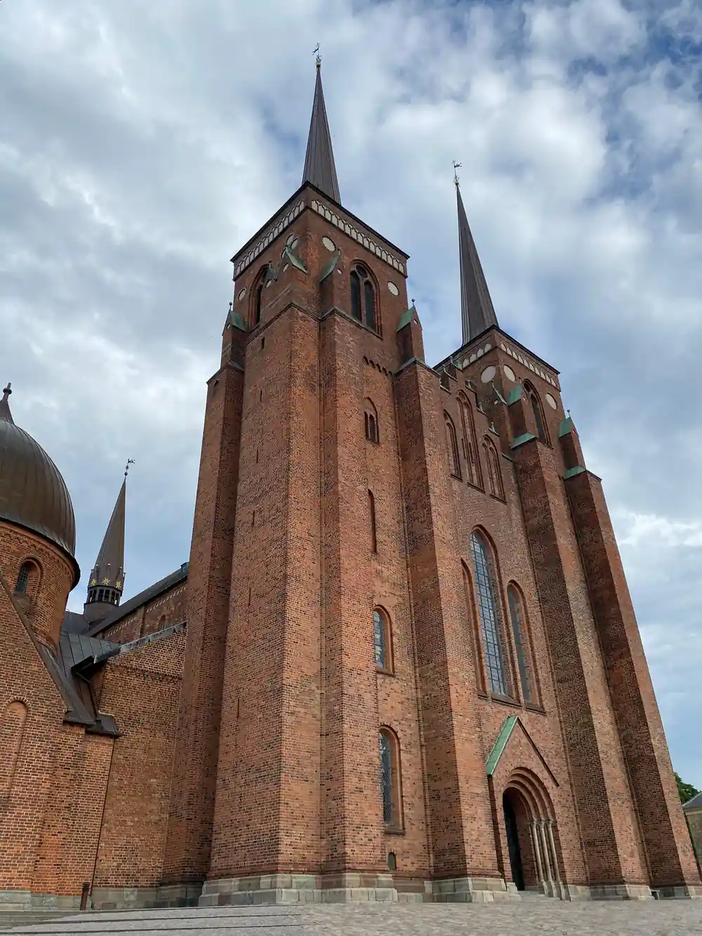 Red brick church with two tall spires