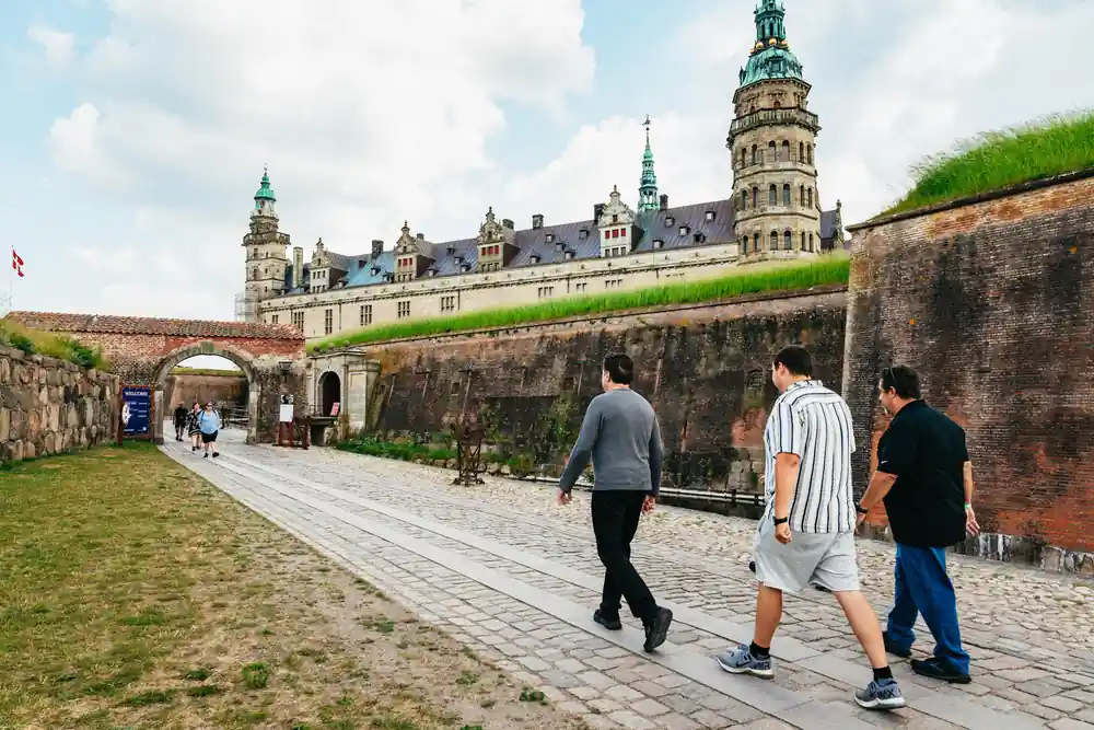 Runners jogging along fortress walls in historic fort grounds
