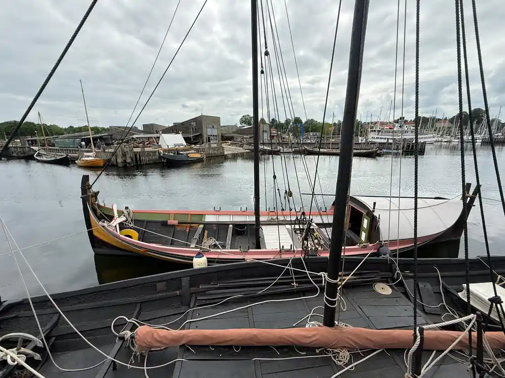 Traditional sailing boat in harbor with rigging